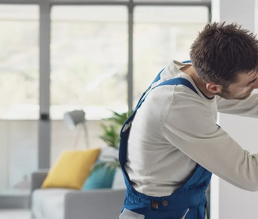 A heating engineer working on a domestic boiler